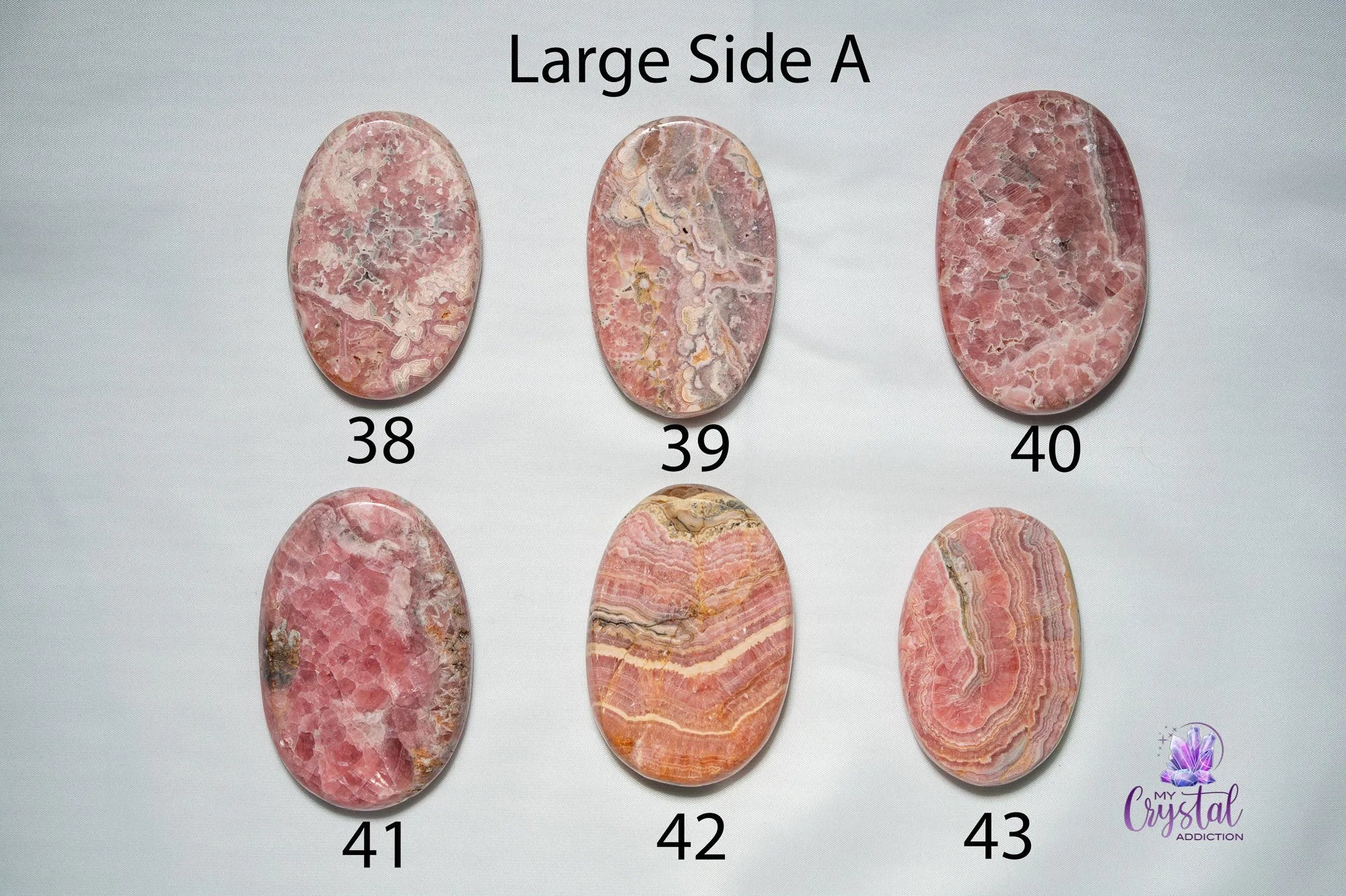 Rhodochrosite Palm Stone - My Crystal Addiction