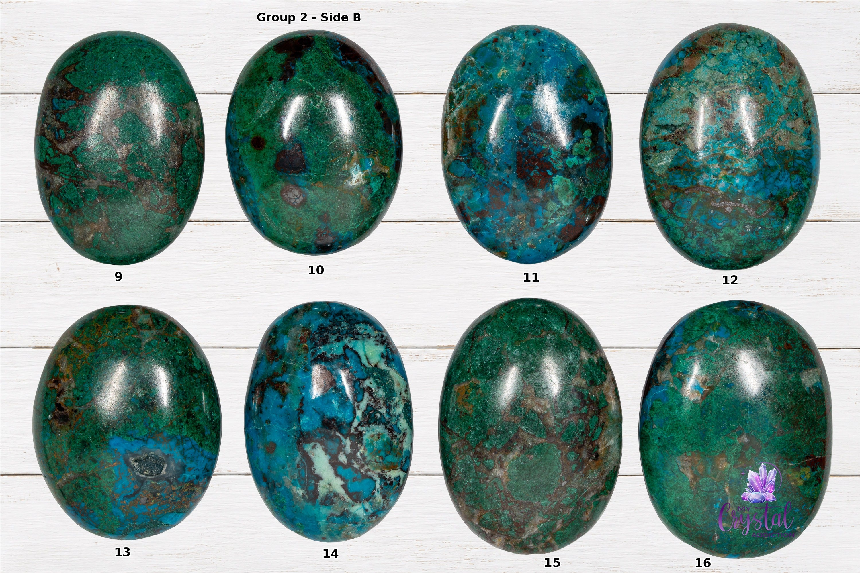 Back sides of chrysocolla palm stones numbered 9 through 16 on a white wood background.