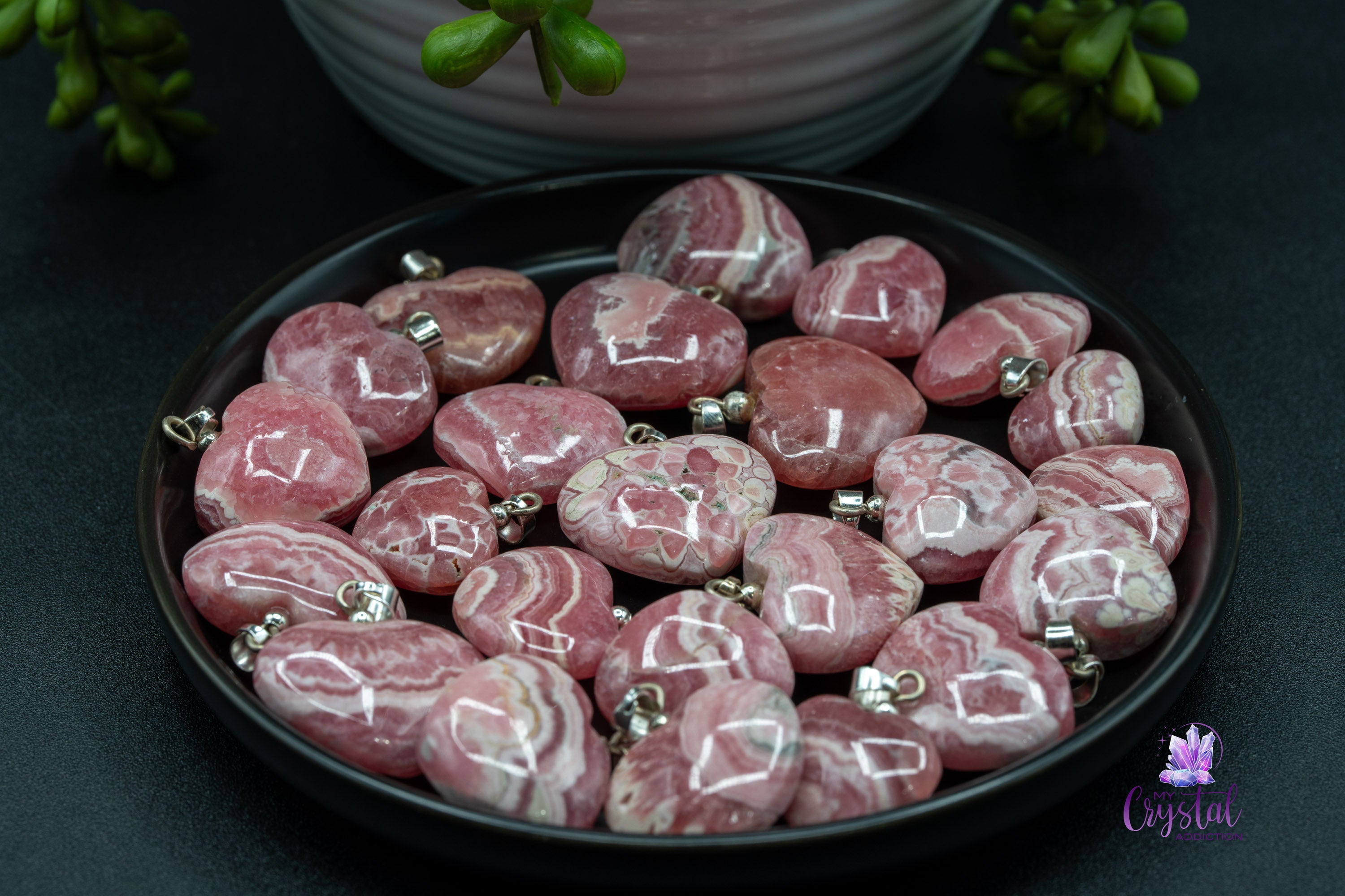 Rhodochrosite heart pendant on black plate